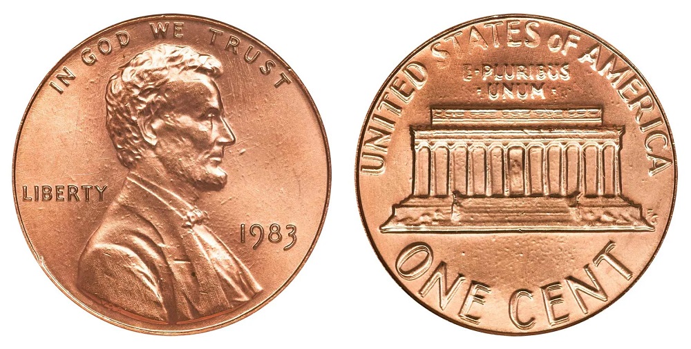 1983 penny grading strip showing four condition tiers from worn to gem uncirculated